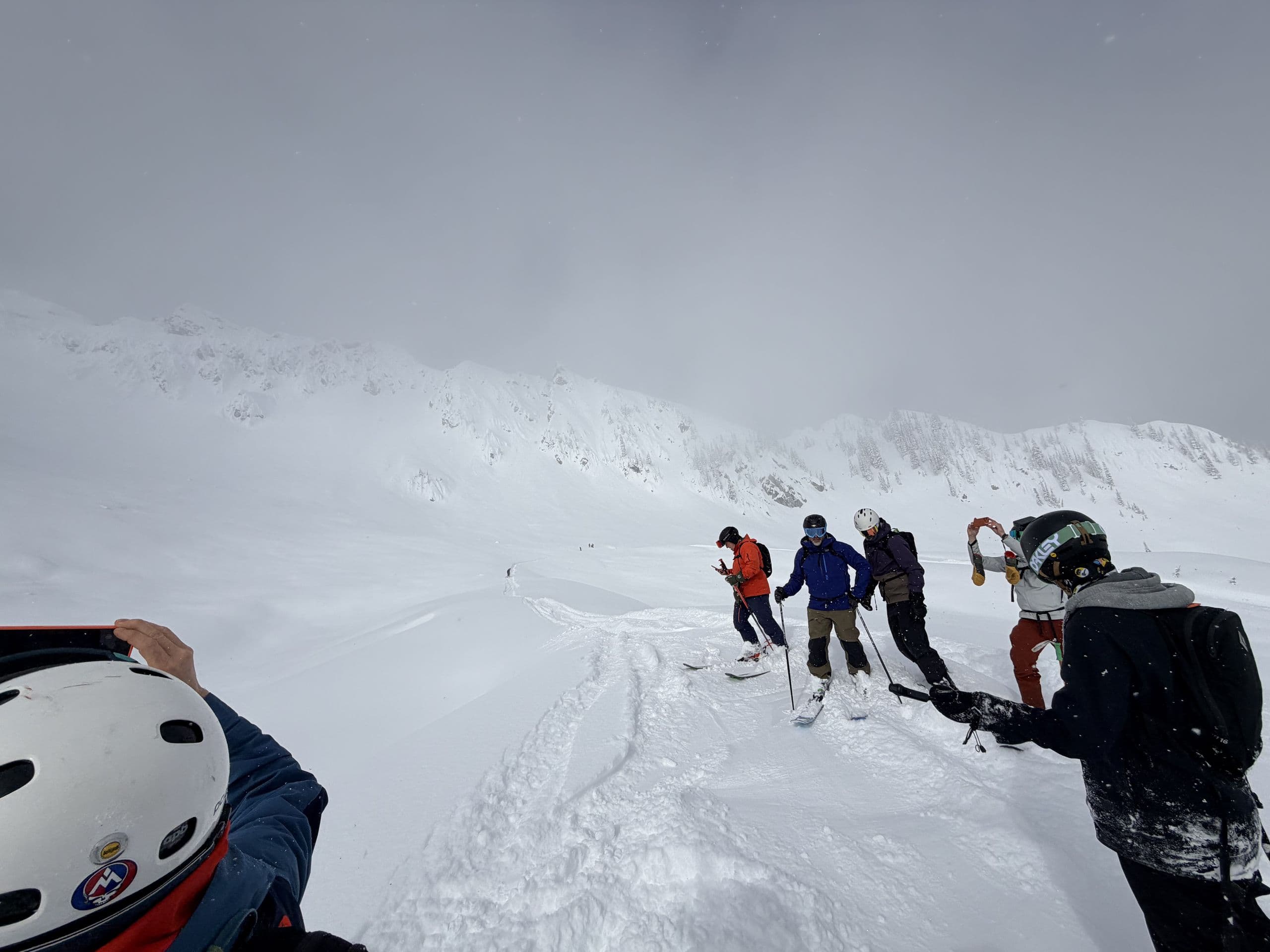 Backcountry skiing group on a mountain ridgeline